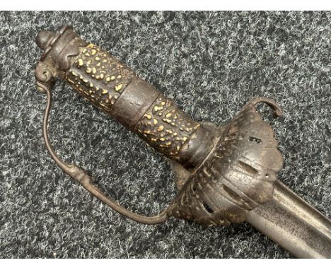 Cutlass with double fullered curved blade 620mm in length. Engraved decoration to blade. Clamshell guard. Two part Horn grip.
