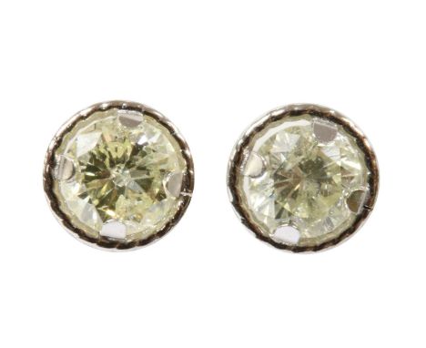 A pair of white gold diamond stud earrings, a brilliant cut diamond, with a total estimated weight of approximately 0.46ct, c