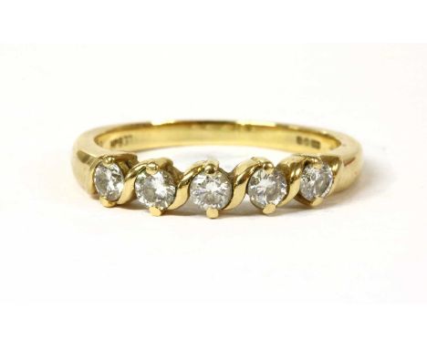 An 18ct gold five stone diamond ring, a row of brilliant cut diamonds, with an estimated weight of approximately 0.50ct total