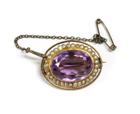 An gold amethyst and split pearl brooch, an oval mixed cut amethyst milligrain set to a plain collet at the centre, with surr