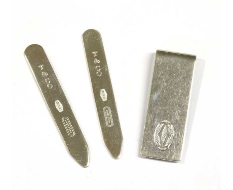 A sterling silver money clip, by Cartier, with the Cartier 'double C' logo to the front, London 2005, with box, together with