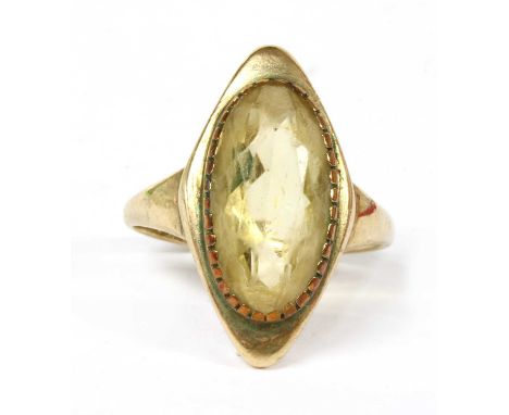 A 9ct gold single stone citrine ring, an oval mixed cut citrine, claw set to a marquise shaped head, with tapered shoulders a