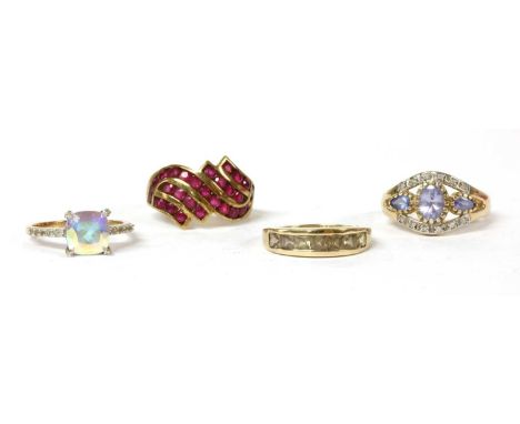 Four 9ct gold gem set rings, to include a 9ct gold ruby dress ring, with five rows of circular mixed cut rubies channel set t