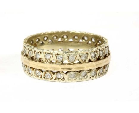 A gold paste set full eternity ring, tested as approximately 9ct gold, 5.46g.Finger size R¼ LE