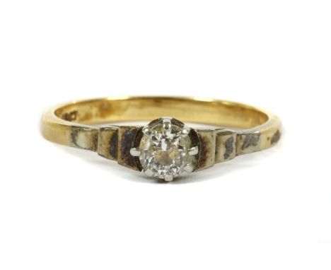 A gold single stone diamond ring, an old European cut diamond, claw set to stepped shoulders and a D section shank, marked 18