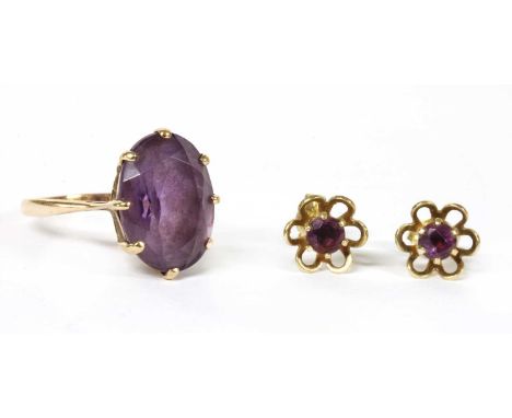 A 9ct gold single stone amethyst ring, c.1970, by Cropp &amp; Farr, with an oval mixed cut amethyst, claw set to tapered open