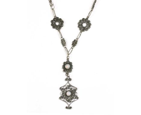 A silver opal filigree necklace, two cabochon opals claw set to the filigree pendant, to necklace of filigree links with oxid