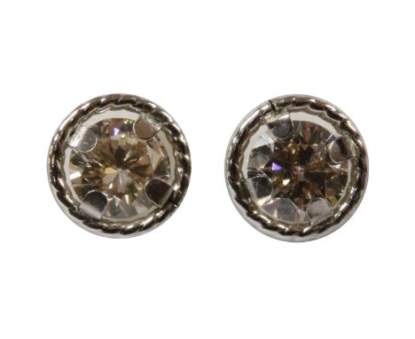 A pair of white gold diamond stud earrings, a brilliant cut diamond, with a total estimated weight of approximately 0.36ct, c