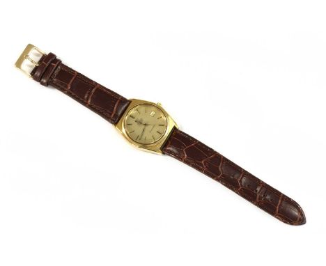 A gentlemen's gold plated Omega 'Seamaster' quartz strap watch, c.1980, ref. 196.0088, tonneau shaped case, 35 x 36mm, with a