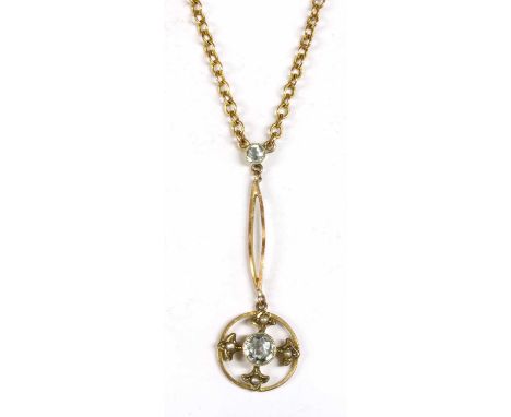 A gold aquamarine and split pearl Edna May pendant, a circular mixed cut aquamarine, milligrain set to a plain collet, with o