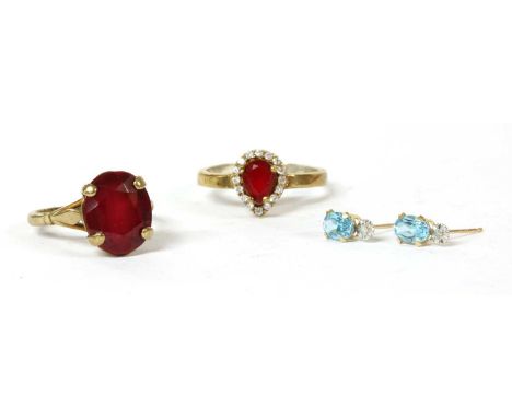 A 9ct gold single stone synthetic ruby ring, London 1970, 3.82g, finger size L, together with a pair of gold blue topaz earri