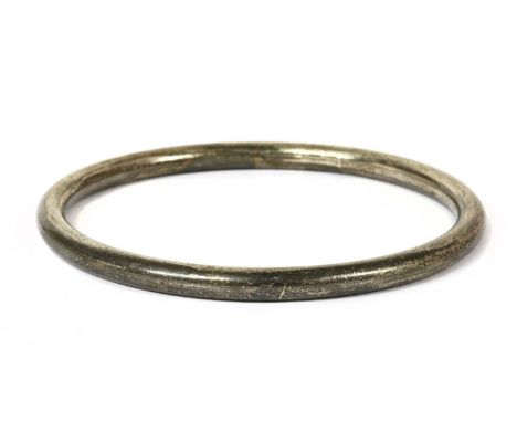 A Danish sterling silver bangle by Hans Hansen, of round section, marked Hans Hansen, 925S, Denmark, import hallmark London 1