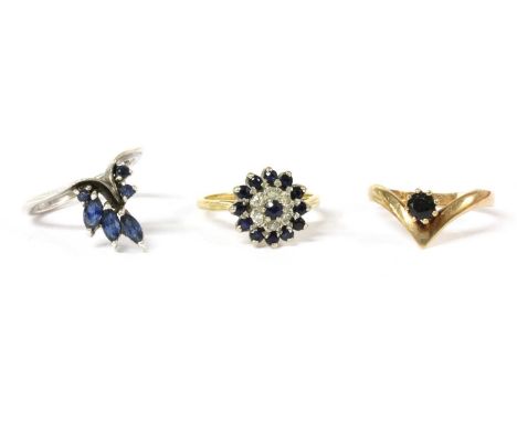 An 18ct gold sapphire and diamond cluster ring, hallmark worn, 3.78g, together with a 9ct gold single stone sapphire wishbone