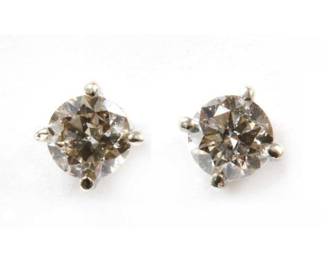 A pair of 9ct white gold diamond stud earrings, a brilliant cut diamond, with a total estimated weight of approximately 0.42c