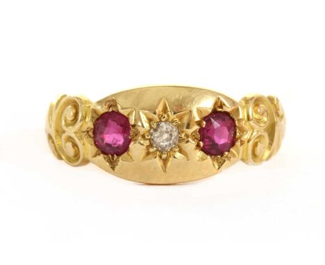 An 18ct gold three stone diamond and ruby set ring, by Deakin and Francis, c.1900, 3.31g.Finger size K (approximately)Conditi