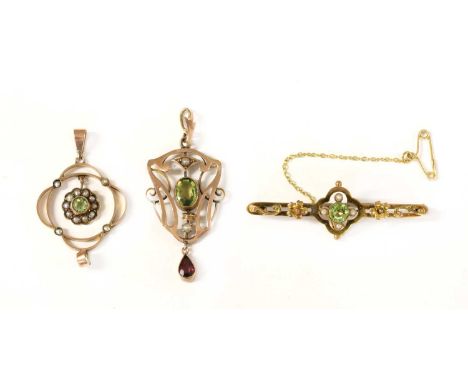 A gold Edwardian peridot and split pearl pendant, tested as approximately 9ct gold, together with a gold garnet-and-glass dou