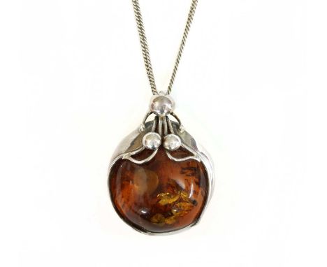 A sterling silver amber pendant, 64 x 47mm, Polish assay marks 1986 to present, for Gdansk, suspended on a silver curb link c