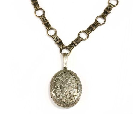 A Victorian silver locket and collar, the oval locket with pierced foliate design, suspended from collar with gathered pierce