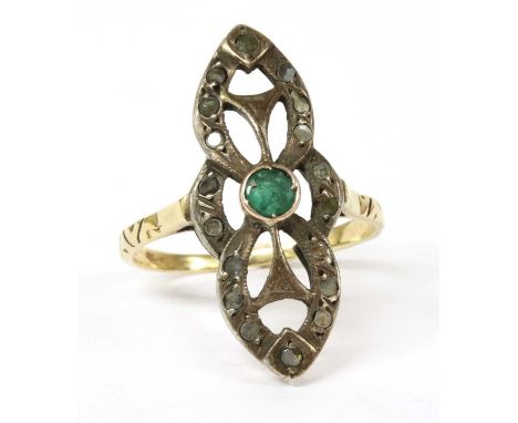 A silver and gold, emerald and diamond fingerline ring, a circular mixed cut emerald, spitch set to a gold collet, to openwor