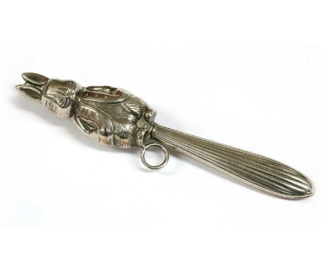 A silver baby's rattle, modelled as Peter Rabbit, with hollow body, loop fitting to feet, and reeded handle, tested as approx