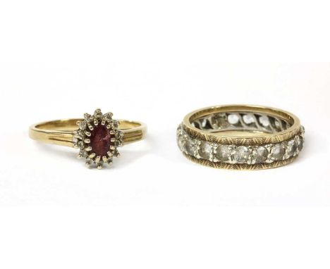 A 9ct gold ruby and diamond cluster ring, London 1991, together with a 9ct gold and white gold gem set full eternity ring, 6.