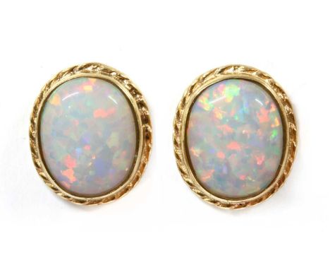 A pair of 9ct gold synthetic opal stud earrings, an oval cabochon synthetic opal, rub set with rope edge, to post and scroll 