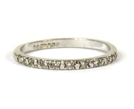 An 18ct white gold diamond half eternity ring, a row of brilliant cut diamonds, with a stated total weight of 0.13ct, grain s