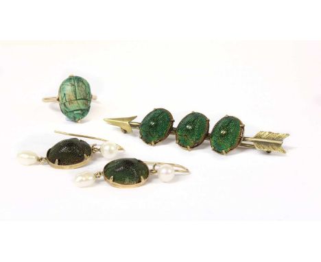 A silver gilt scarab beetle set arrow brooch, three scarab beetles claw set to the arrow bar brooch, with metal pin and 'C' c