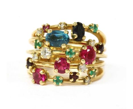 An 18ct gold multi-gem ring, five strand head claw set with scattered gemstones, to include brilliant cut diamonds, circular 