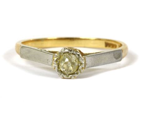 A gold single stone diamond ring, an old cut diamond grain set to an illusion collet, with white gold shoulders and a plain y