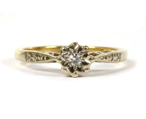 An 18ct gold single stone diamond ring, an eight cut diamond grain set to a white gold illusion collet, with white gold cheni