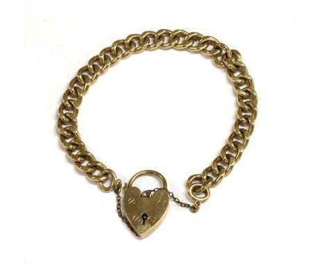 A 9ct gold curb bracelet, by Cropp &amp; Farr, with heart shaped padlock clasp and metal safety chain, Birmingham 1963, 28.29