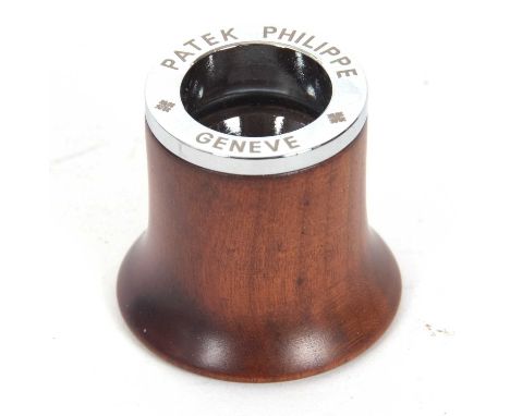 A Patek Philippe Geneve eye magnifying glass