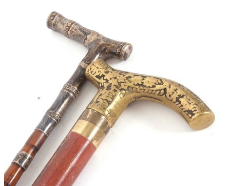 Vintage bamboo shaft walking stick with silver plated mounts together with a later brass mounted example with screw on handle