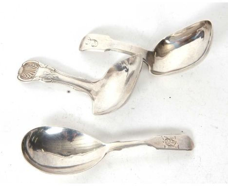 Group of three silver caddy spoons, a George III shell and thread example, having a square shaped bowl, engraved below with i