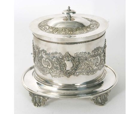 An early 20th Century Mappin &amp; Webb princes plate biscuit barrel of oval form and the body embossed and engraved with a b