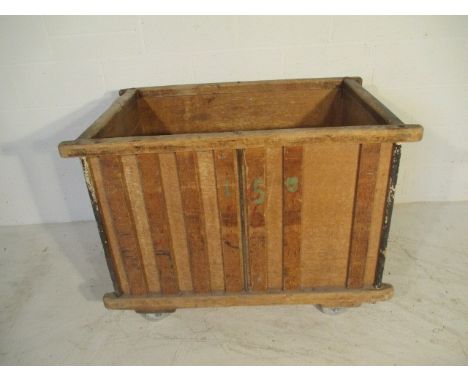 A slatted wooden bobbin trolley with ply lining, 109 cm x 71 cm