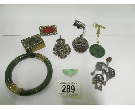 A mixed lot of ethnic and oriental pendants etc including jade
