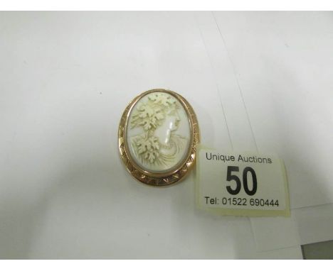 A vintage cameo female profile set in 14ct rose gold