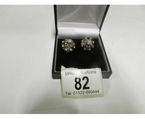 A pair of multi gem screw back earrings set ruby, sapphire, moonstone in unmarked gold settings