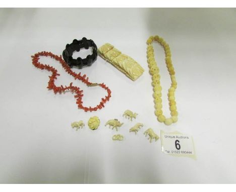 A small collection of vintage jewllery including Whitby jet bracelet, carved necklace, carved bracelet and a collection of ca