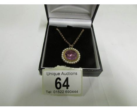 An antique amethyst and pearl pendant in unmarked gold setting and on chain