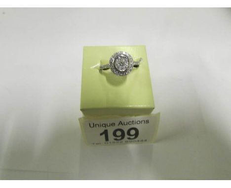 A white gold ring set 2 circles of diamonds, size R