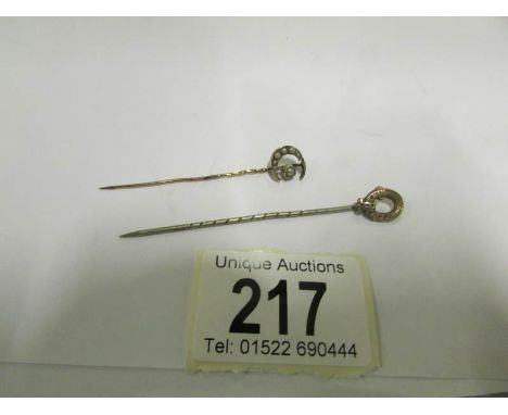 2 gold tie pins