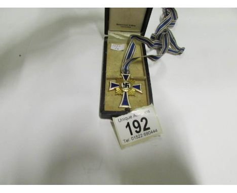 A German Nazi ladies enamel birth medal in original box