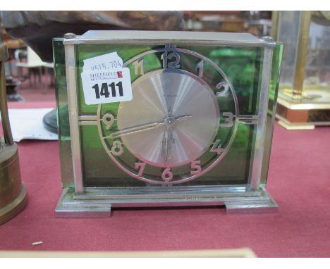 Jaz eight Day Art Deco Mantle Clock, in chrome and green glass, 16cm wide.