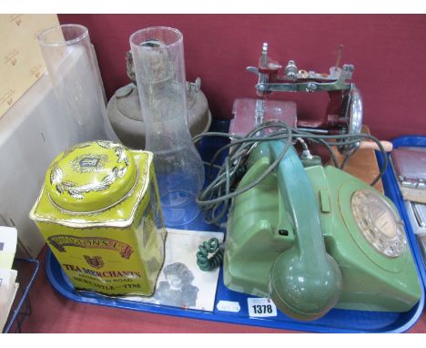 Green Plastic Anvil Telephone, 'Essex' sewing machine, oil lamp, tin:- One Tray