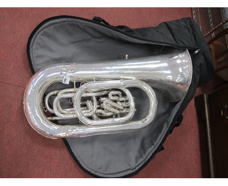 A Besson Class 'A' New Standard Double E Flat Four Valve Tuba in Silver Plate, approximately 87cm high, together with Dennis 