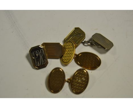 A pair of 9ct gold cufflinks, oval engine turned, another pair silver gilt, monogrammed, engine turned 8.0g