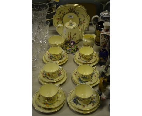 A Crown Staffordshire tea service,hand painted  with colourful summer flowers, retailed by T Goode, pattern no.713318